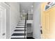 Inviting entryway with staircase and view into kitchen at 3327 Deerwood Dr, Gastonia, NC 28054