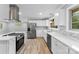Modern kitchen featuring white cabinets and stainless steel appliances at 3327 Deerwood Dr, Gastonia, NC 28054