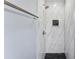Modern shower with marble-style tile and hexagonal floor at 3327 Deerwood Dr, Gastonia, NC 28054