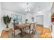 Bright dining room with hardwood floors and a square wooden table at 482 Lazywood Ln, Fort Mill, SC 29715