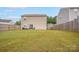 Spacious backyard with a large grassy area and wooden fence at 1197 Tangle Ridge Se Dr, Concord, NC 28025