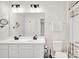 Double vanity bathroom with a large mirror and shower at 1197 Tangle Ridge Se Dr, Concord, NC 28025