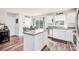 Well-lit kitchen with granite countertops, stainless steel appliances, and a view of the dining area and sliding door at 1197 Tangle Ridge Se Dr, Concord, NC 28025