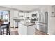 Bright kitchen featuring stainless steel appliances, an island with countertop, and a view of the dining area at 1197 Tangle Ridge Se Dr, Concord, NC 28025