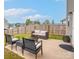 Relaxing outdoor patio with comfortable seating and a fire pit for entertainment at 1197 Tangle Ridge Se Dr, Concord, NC 28025