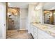 Elegant bathroom featuring a double vanity, granite countertop, and large shower at 166 Wylie Trl # 25, Statesville, NC 28677