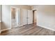 Well-lit bedroom with hardwood floors and access to a full bathroom at 166 Wylie Trl # 25, Statesville, NC 28677