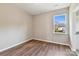 Bright bedroom with hardwood floors and a large window at 166 Wylie Trl # 25, Statesville, NC 28677