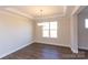 Bright dining room with hardwood floors and elegant chandelier at 166 Wylie Trl # 25, Statesville, NC 28677