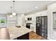 Bright kitchen featuring granite countertops, stainless steel appliances, and an island at 166 Wylie Trl # 25, Statesville, NC 28677