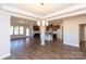 Open floorplan showcasing kitchen, dining, and living areas with hardwood floors at 166 Wylie Trl # 25, Statesville, NC 28677