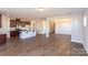 Open concept floorplan with kitchen, dining area, and hardwood floors at 166 Wylie Trl # 25, Statesville, NC 28677