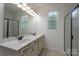 Bright bathroom featuring double sinks, shower with glass door and natural light at 1957 Tablerock Dr, York, SC 29745