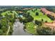 Aerial view of a golf course with a pond and lush green fairways at 327 Bezelle Ave, York, SC 29745