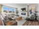 Living room with fireplace and large windows overlooking backyard at 327 Bezelle Ave, York, SC 29745