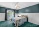 Bedroom with green carpet, double doors and ceiling fan at 141 Red Brook Ln, Mooresville, NC 28117