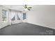 Bright bedroom featuring bay windows and grey carpet at 141 Red Brook Ln, Mooresville, NC 28117