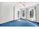 Bedroom with blue carpet, double windows and private balcony at 141 Red Brook Ln, Mooresville, NC 28117