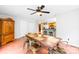 Open dining area with wood floors, a rustic table, and views of the kitchen at 141 Red Brook Ln, Mooresville, NC 28117