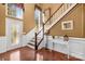 Grand entryway with hardwood floors, elegant staircase, and stained glass door at 141 Red Brook Ln, Mooresville, NC 28117