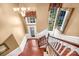 Two-story entryway showcasing hardwood floors and a graceful staircase at 141 Red Brook Ln, Mooresville, NC 28117