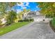 Two-story house with a three-car garage and landscaped lawn at 141 Red Brook Ln, Mooresville, NC 28117