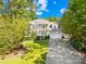 Two-story house with a three-car garage and large front yard at 141 Red Brook Ln, Mooresville, NC 28117