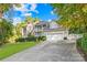 Two-story house with a three-car garage and landscaped lawn at 141 Red Brook Ln, Mooresville, NC 28117