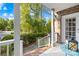 Inviting front porch with white railing, offering a view of the street and landscaping at 141 Red Brook Ln, Mooresville, NC 28117