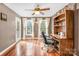 Bright home office features built-in shelving, hardwood floors, and access to exterior at 141 Red Brook Ln, Mooresville, NC 28117