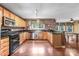 Eat-in kitchen with stainless steel appliances and brick accent wall at 141 Red Brook Ln, Mooresville, NC 28117