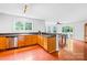 Bright kitchen showcasing wood floors, ample counter space, and a view into the breakfast area at 141 Red Brook Ln, Mooresville, NC 28117