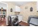 Laundry room with washer, dryer, and cabinets at 141 Red Brook Ln, Mooresville, NC 28117