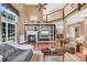 Two-story living room with hardwood floors, fireplace, and built-in shelving at 141 Red Brook Ln, Mooresville, NC 28117