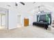 Large primary bedroom with high ceilings, ceiling fans, and a view of the backyard at 141 Red Brook Ln, Mooresville, NC 28117