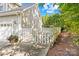 Landscaped side yard with gate and walkway at 141 Red Brook Ln, Mooresville, NC 28117