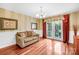 Bright sunroom with hardwood floors and french doors leading to a patio at 141 Red Brook Ln, Mooresville, NC 28117