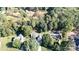 Aerial view of a quiet residential neighborhood with tree-lined streets and houses at 1499 Angela Ct, Lincolnton, NC 28092