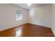 Simple bedroom with hardwood floors and a window with blinds at 1499 Angela Ct, Lincolnton, NC 28092