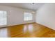 Simple dining area with hardwood floors and a chandelier at 1499 Angela Ct, Lincolnton, NC 28092