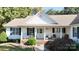 White house with a brown roof, front porch, and landscaping at 1499 Angela Ct, Lincolnton, NC 28092