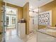 Elegant bathroom with a glass shower, stained glass window, and granite vanity at 316 W Kingston Ave, Charlotte, NC 28203