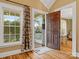 Inviting entryway with hardwood floors and views into the living room at 316 W Kingston Ave, Charlotte, NC 28203