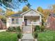 Charming bungalow with front porch, landscaping, and brick detailing at 316 W Kingston Ave, Charlotte, NC 28203