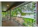 Covered balcony offering scenic lake views at 165 Woodstream Cir, Mooresville, NC 28117