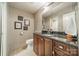 Basement bathroom with dark vanity and granite countertop at 165 Woodstream Cir, Mooresville, NC 28117