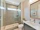 Modern bathroom with tiled shower, sleek vanity, and ample natural light at 5704 Crescent Field Cir # 25, Huntersville, NC 28078