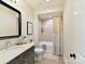 Well-appointed bathroom with modern vanity, framed mirror, and combination shower and bathtub at 8111 Farm Crossing Ln # 2, Huntersville, NC 28078