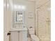 Elegant bathroom with a marbled tile shower and decorative mirror over the vanity at 8111 Farm Crossing Ln # 2, Huntersville, NC 28078