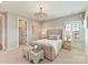 Cozy bedroom featuring a plush bed, nightstands, stylish lighting, and neutral decor at 8111 Farm Crossing Ln # 2, Huntersville, NC 28078